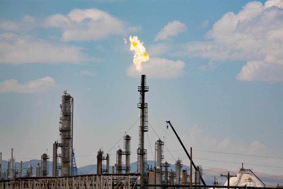 Burning off excess natural gas (flaring) at oil refinery, Sinclair ...